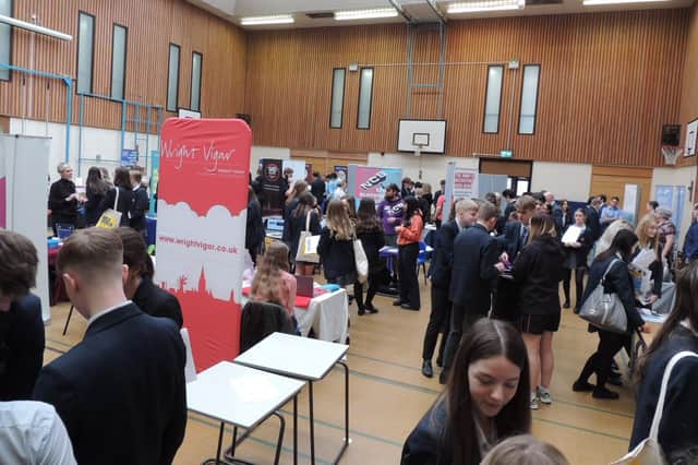 Students researching their potential careers at the fair at St George's Academy. EMN-220104-172537001