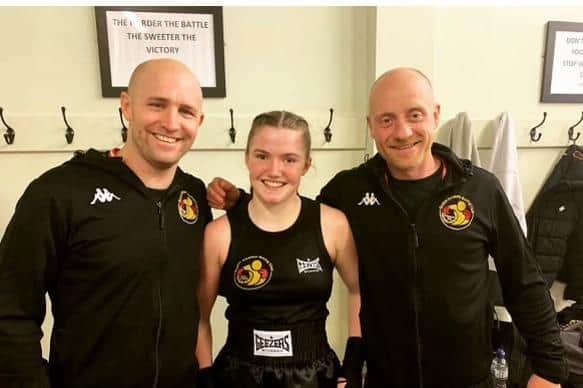 Vienna Barry with coaches Dennis Watson and Matt Mooney.