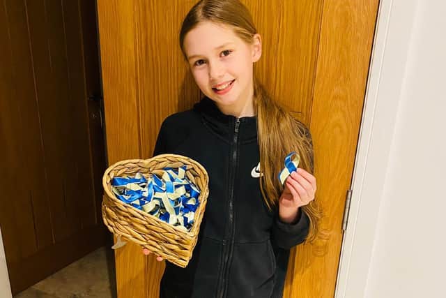 Belle Nicholls, 10, has been making blue and yellow ribbons for the Ukraine Appeal in support of UNICEF and the Red Cross.
