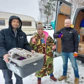 Lucie Mountain unloading the van load of donated items in Poland