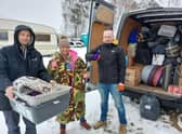 Lucie Mountain unloading the van load of donated items in Poland