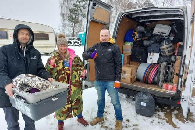 Lucie Mountain unloading the van load of donated items in Poland