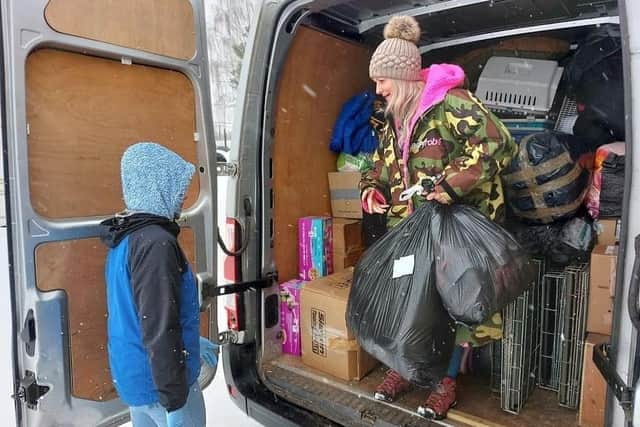 Lucie Mountain sets about unloading the van in Poland