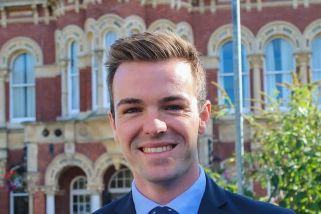 Leader of SKDC Coun Kelham Cooke, in front of the St Peter's Hill offices.