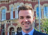 Leader of SKDC Coun Kelham Cooke, in front of the St Peter's Hill offices.