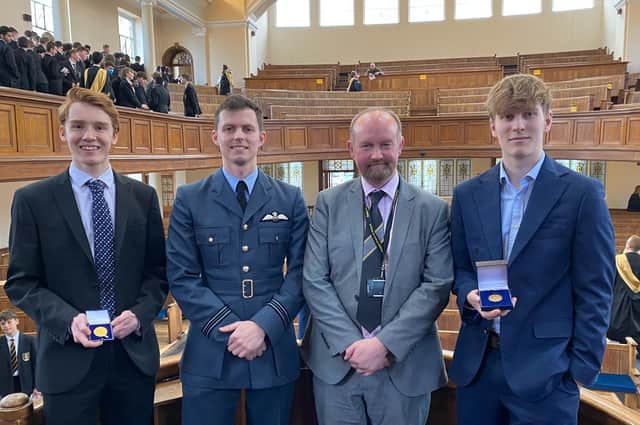 2020 winner Harry Hopkins, Flt Lt Jack Bosworth, headteacher John McHenry, and 2021 winner Matthew Dickens.
