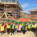 Hawthorn Tree pupils pictured on their site visit to the Saxon Grange development near their school. Images supplied.