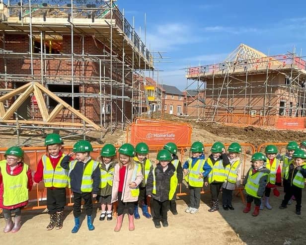 Hawthorn Tree pupils pictured on their site visit to the Saxon Grange development near their school. Images supplied.