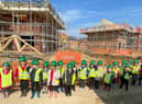 Hawthorn Tree pupils pictured on their site visit to the Saxon Grange development near their school. Images supplied.