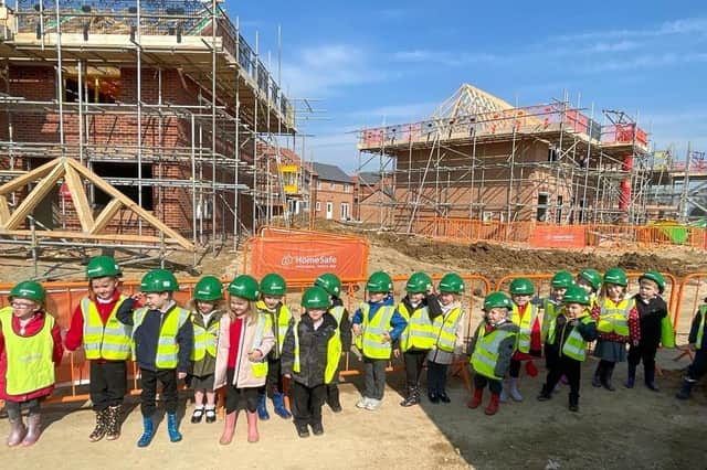 Hawthorn Tree pupils pictured on their site visit to the Saxon Grange development near their school. Images supplied.