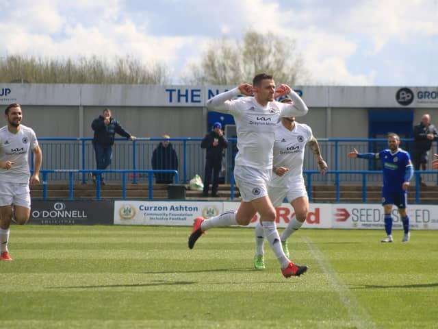 Joe Leesley celebrates his goal with a pointed message. Photo: Oliver Atkin