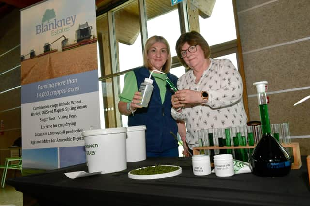 L-R Sarah Hand and Helen Hopkinson of Blankney Estates with water and oil Chlorophyll, extracted from grass. EMN-221104-093053001