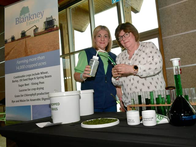 L-R Sarah Hand and Helen Hopkinson of Blankney Estates with water and oil Chlorophyll, extracted from grass. EMN-221104-093053001