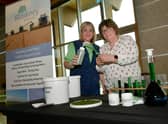 L-R Sarah Hand and Helen Hopkinson of Blankney Estates with water and oil Chlorophyll, extracted from grass. EMN-221104-093053001