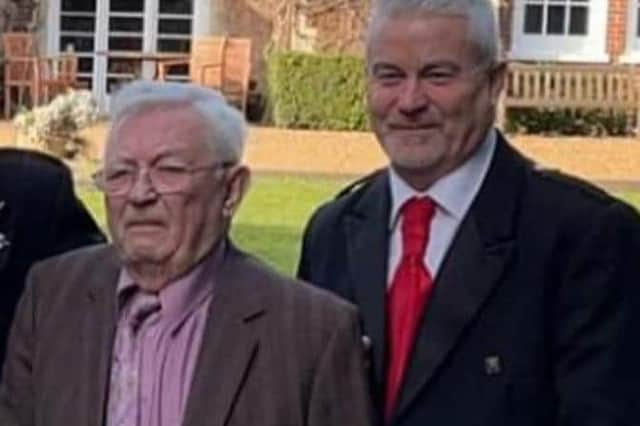 John Cochrane (left) with his son Jock before being taken ill at the wedding.