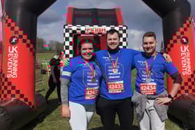 Zoe Berry, of Ruskington, doing the Inflatable 5K with friends Kyle and Matt. EMN-220415-160303001