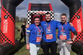 Zoe Berry, of Ruskington, doing the Inflatable 5K with friends Kyle and Matt. EMN-220415-160303001