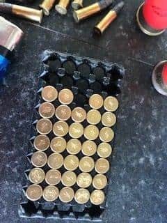Dozens of rifle rounds spilled out of a bag of waste discovered by waste centre workers. EMN-220413-125723001