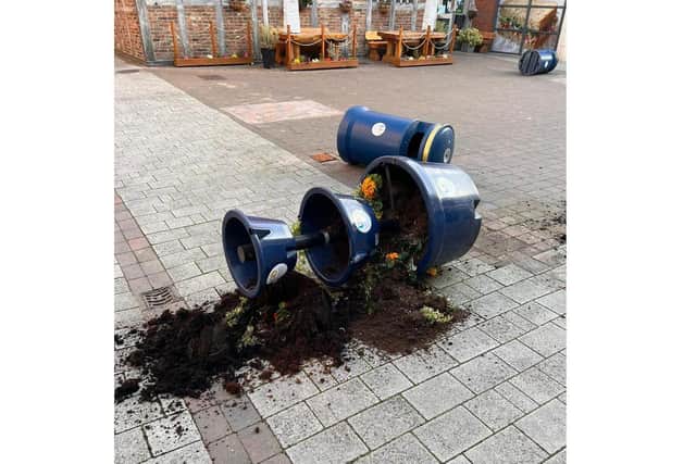 The damaged planter at Pescod Square in Boston.