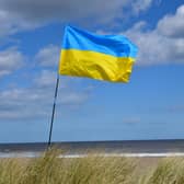 The Ukraine flag flying at a fundraiser at Anderby Creek beach.