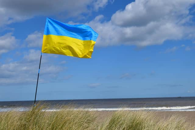 The Ukraine flag flying at a fundraiser at Anderby Creek beach.