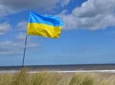 The Ukraine flag flying at a fundraiser at Anderby Creek beach.