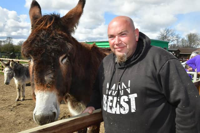 Derrick, one of the largest donkeys in the world, and volunteer Ross Clarke are looking forward to welcoming visitors over Easter.