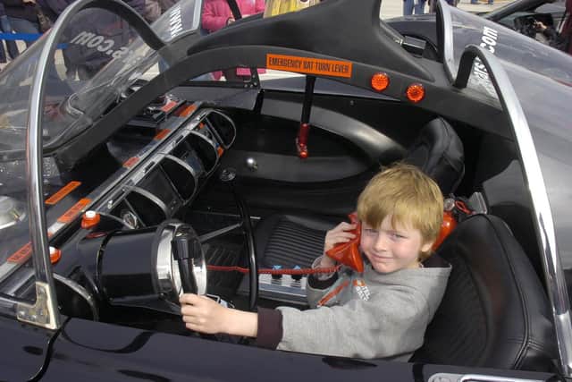 Kai Harris, six, of Cranwell, sitting in the Batmobile.