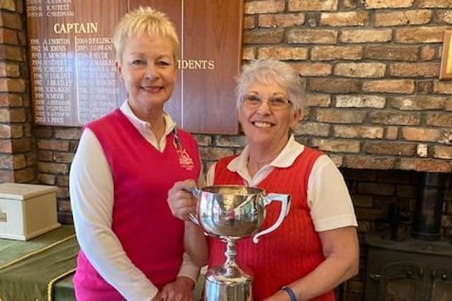 Pictured is Lady Captain Lynn Worthington presenting the Coney Cup to Isabel Pikett.