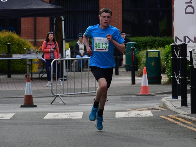 First of the fun runners to finish EMN-220418-133716001