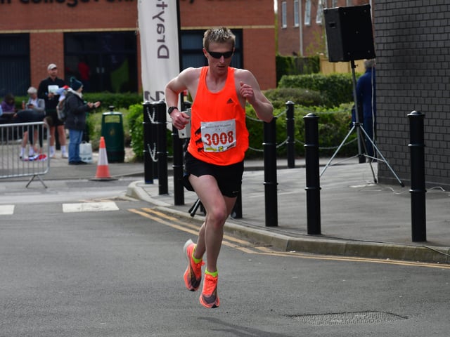 First of the half marathon runners to finish EMN-220418-133743001