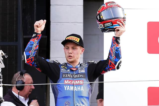 Tim Neave celebrates his first race victory.