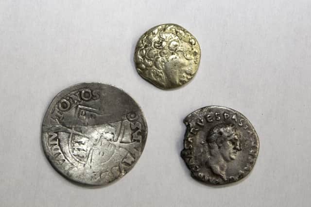 Fascinating Finds: from left - a Tudor period silver coin found at Market Rasen, the gold quarter stater found at Swinhope and a Vespasian silver denarius that was found in East Yorkshire. EMN-220419-151643001