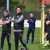Paul Cox (right) watches over Monday's 1-0 win at Brackley. Photo: Oliver Atkin