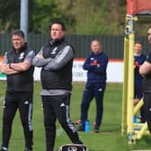 Paul Cox (right) watches over Monday's 1-0 win at Brackley. Photo: Oliver Atkin