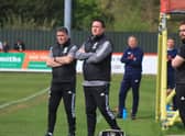 Paul Cox (right) watches over Monday's 1-0 win at Brackley. Photo: Oliver Atkin