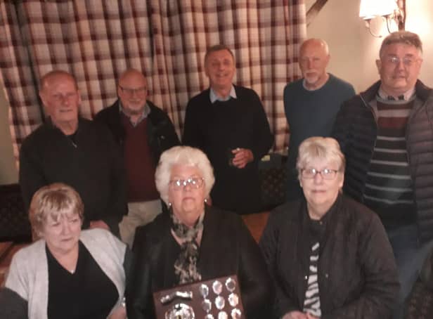 Pictured are the SPC Cosmos team of Rod Stephens, Tony Royce, captain Rob Singleton, Denis Patman, Geoff Dunmore, Ann Ford, Yvonne Walsham and Carole Bolton.