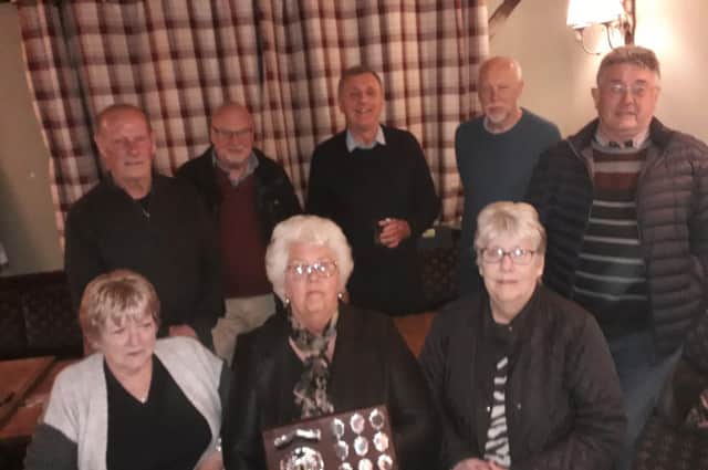 Pictured are the SPC Cosmos team of Rod Stephens, Tony Royce, captain Rob Singleton, Denis Patman, Geoff Dunmore, Ann Ford, Yvonne Walsham and Carole Bolton.