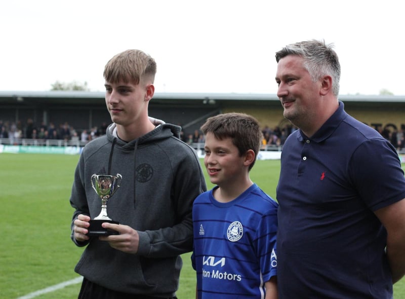 Chris Bray and son Oliver hand the VASS Service Centre U18s Player of the Year award to Finley Rogers. Photo: Oliver Atkin
