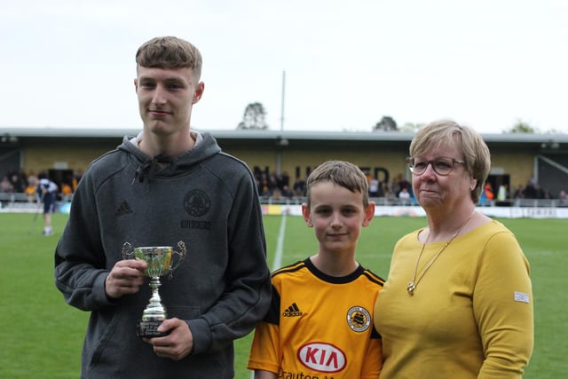 Elliot Foster received the Glen Chapman Memorial Trophy U19s Player of the Year trophy from Pauline Chapoman. Photo: Oliver Atkin