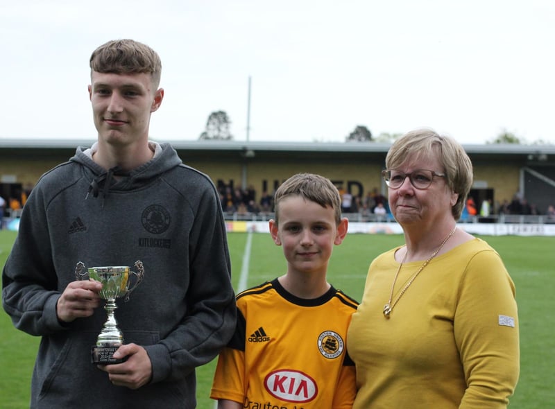 Elliot Foster received the Glen Chapman Memorial Trophy U19s Player of the Year trophy from Pauline Chapoman. Photo: Oliver Atkin