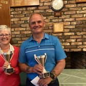 Carol and John Gilchrist with the trophies.