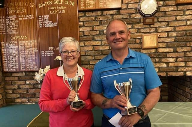 Carol and John Gilchrist with the trophies.