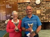 Carol and John Gilchrist with the trophies.
