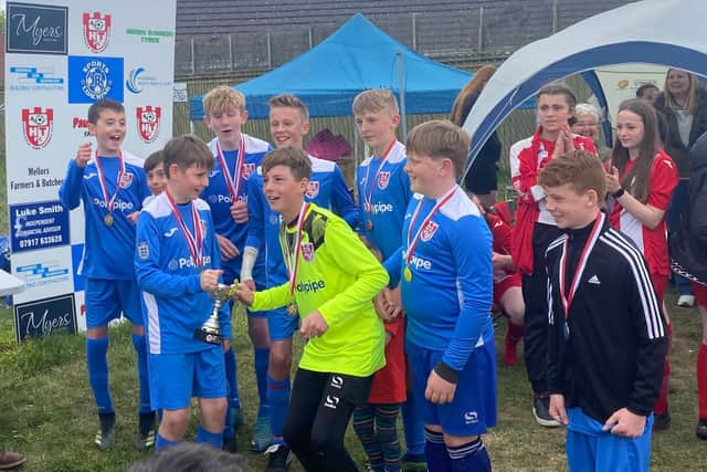 The winners with their medals.