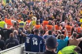 Players and fans celebrate.
