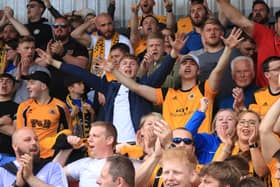 United fans were in full voice at York. Photo: Oliver Atkin