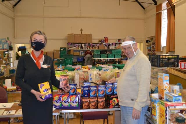 Kamila Brigden, sales advisor at Chestnut Homes, with Bob Taylor from the Boston foodbank
