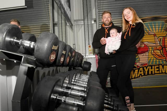 Mayhem Gym owners, Thomas and Sarah Chenery with their 5-month-old daughter, Florence.