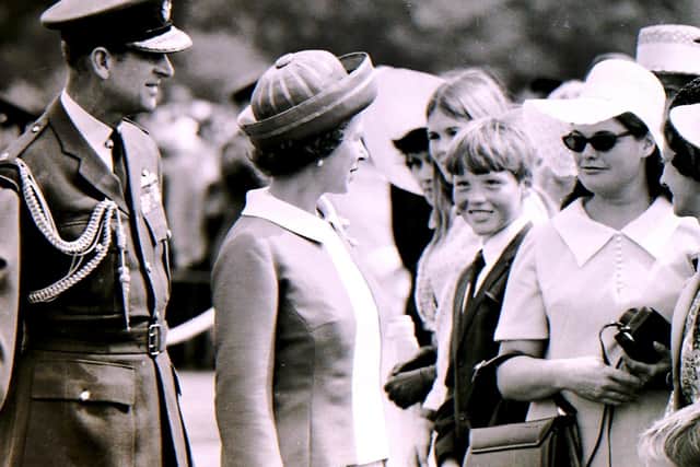 The Duke of Edinburgh with the Queen on their visit to RAF College Cranwell in 1970. EMN-211204-152116001